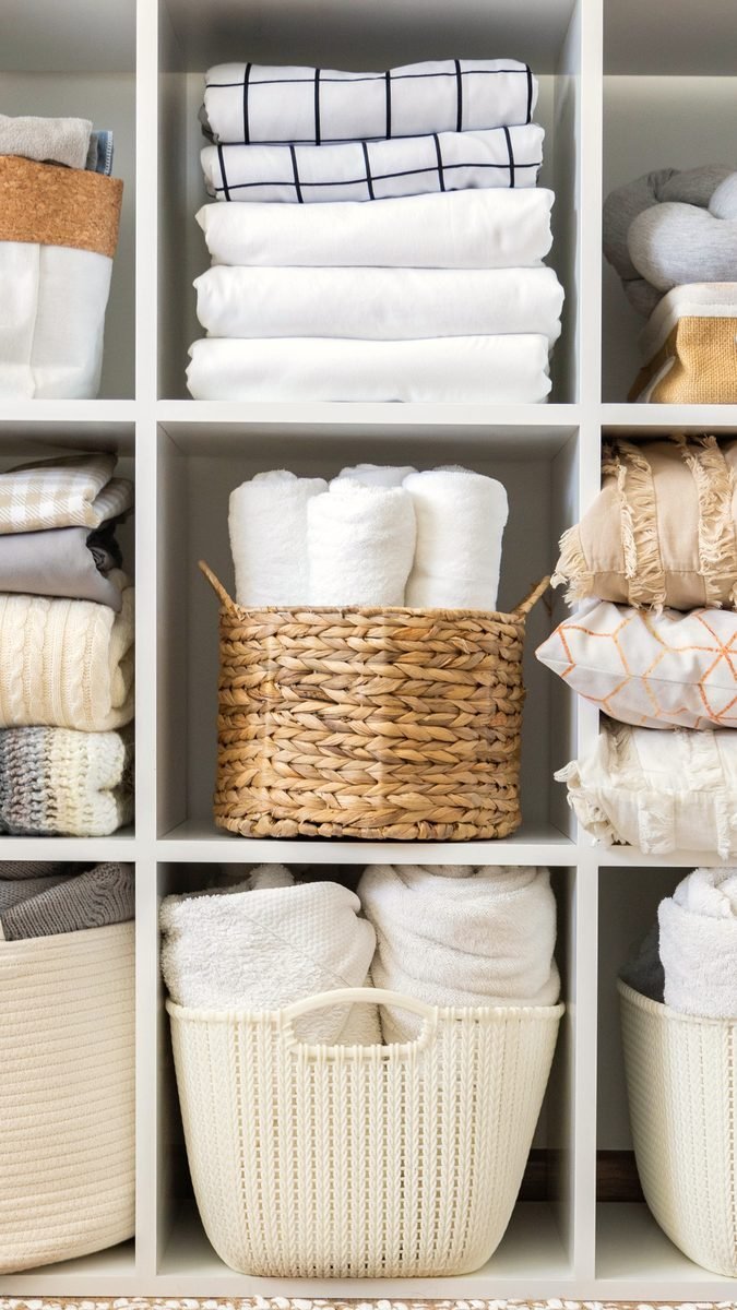 A linen closet, folded and labeled